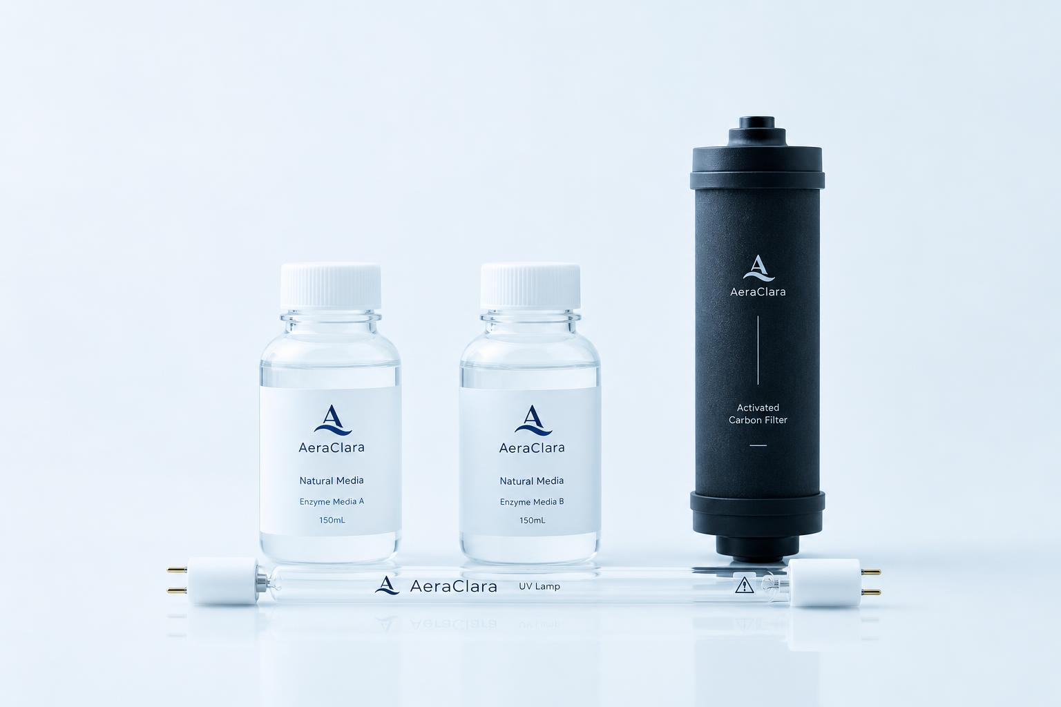 AeraClara enzyme solution bottle, activated carbon filter cartridge, and replacement UV lamp arranged together